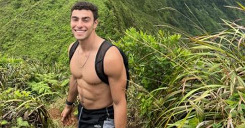 Luigi Mangione without a shirt on in the jungle.