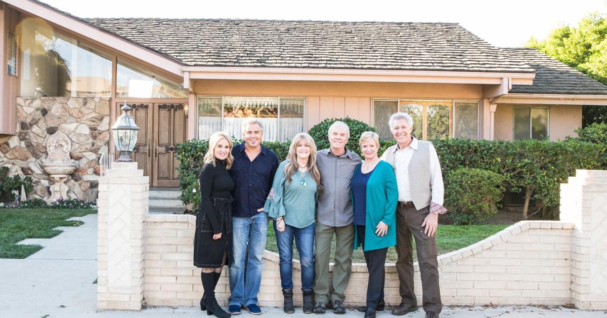 Some of the original 'Brady Bunch' cast stands in front of the 'Brady' house