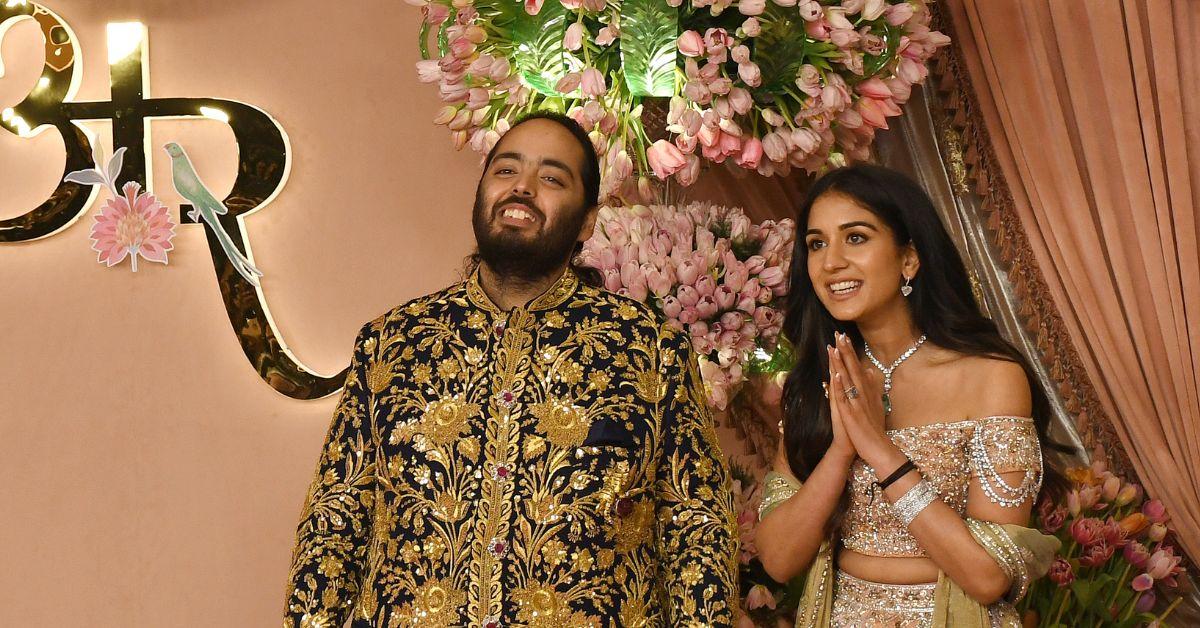 Anant Ambani and his Radhika Merchant pose for a photo on the red carpet during the sangeet ceremony at Jio World Centre in Mumba