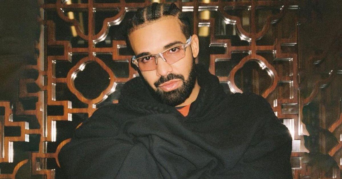 Drake wearing glasses and black coat