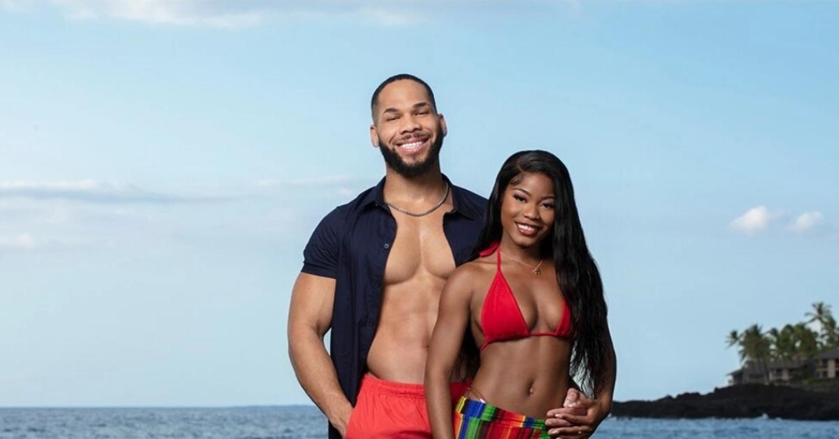 Paris and Great from Season 5 of 'Temptation Island' pose and smile on the beach.