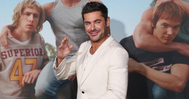 Zac Efron attends 'The Iron Claw' Dallas premiere in white suit.