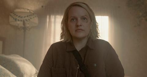 June sitting on the bed in Season 6 of 'The Handmaid's Tale'.