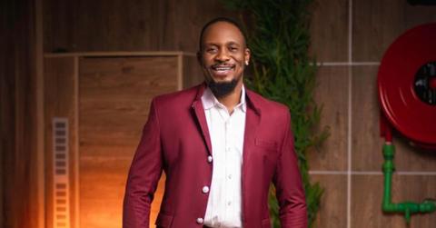 Junior Pope in a red suit