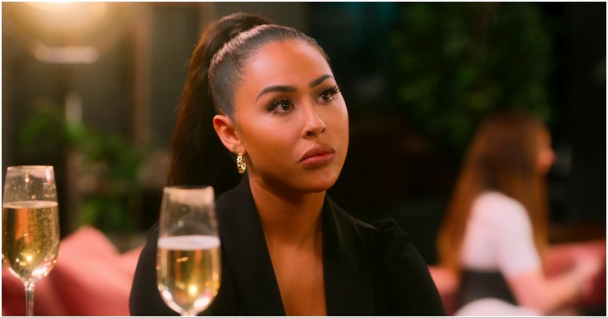 Kayla Cardona of Netflix's Selling OC drinking a glass of wine