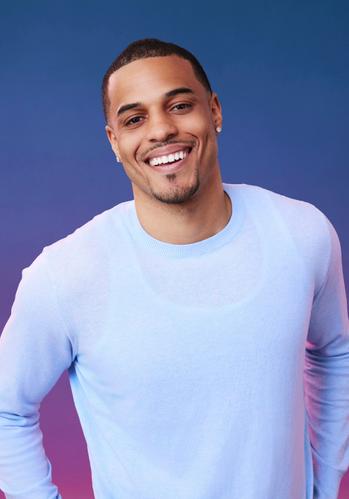 Grant poses in front of a blue-purple ombré background for his official 'The Bachelorette' Season 21 portrait.