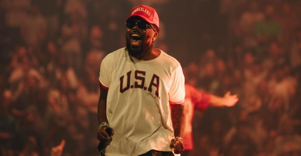Chandler moore wearing a USA shirt and holding a microphone on stage