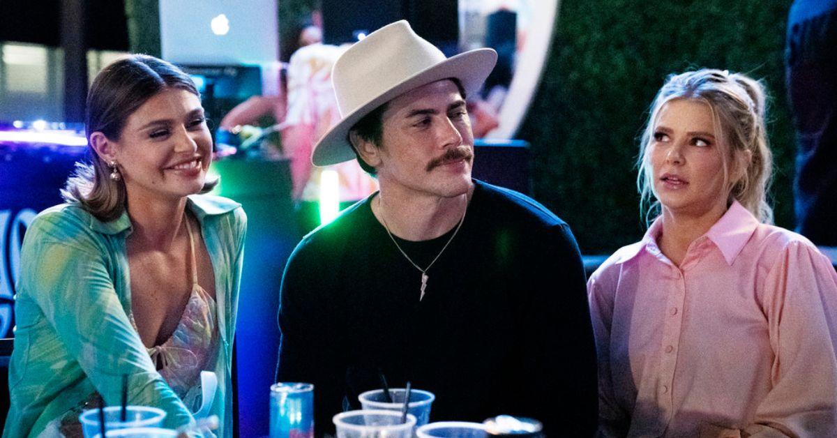 (l-r): Raquel Leviss, Tom Sandoval, and Ariana Madix sitting and talking.