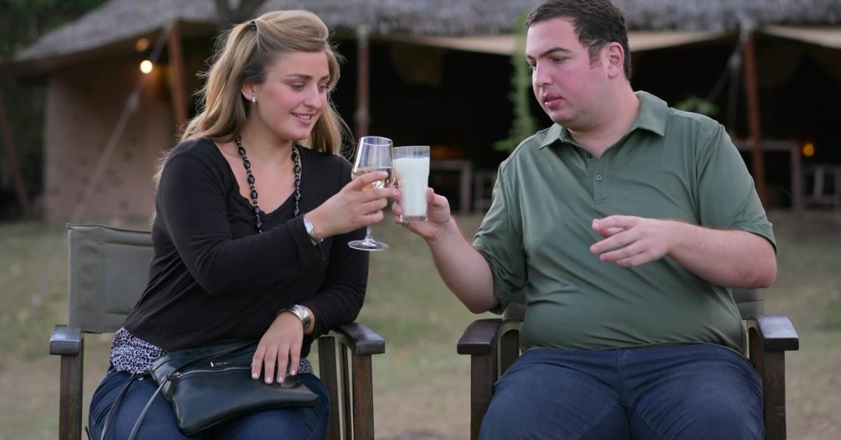 Abbey and David share a toast while vacationing in Africa.