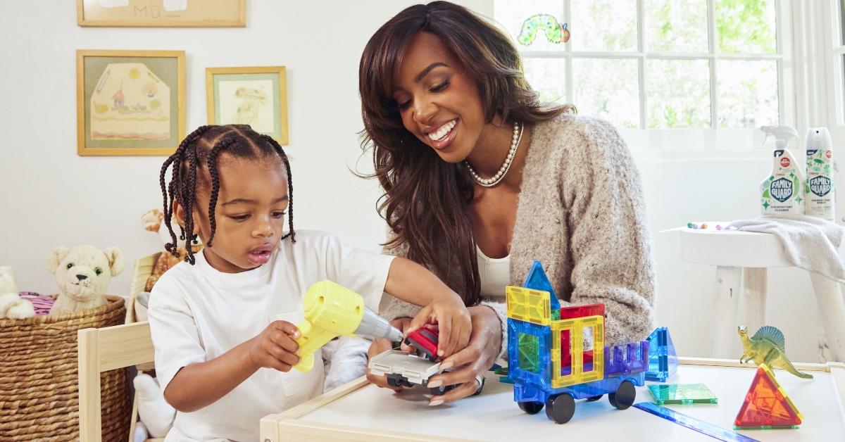 Kelly Rowland and her son playing with toys