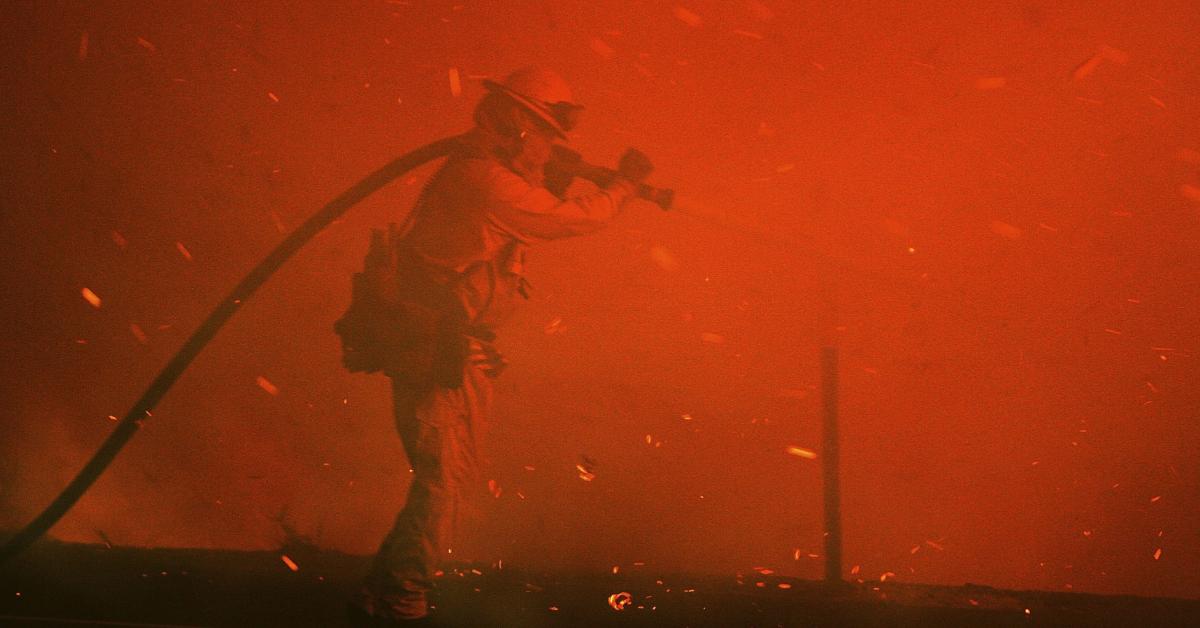 A firefighter battles a deadly fire.