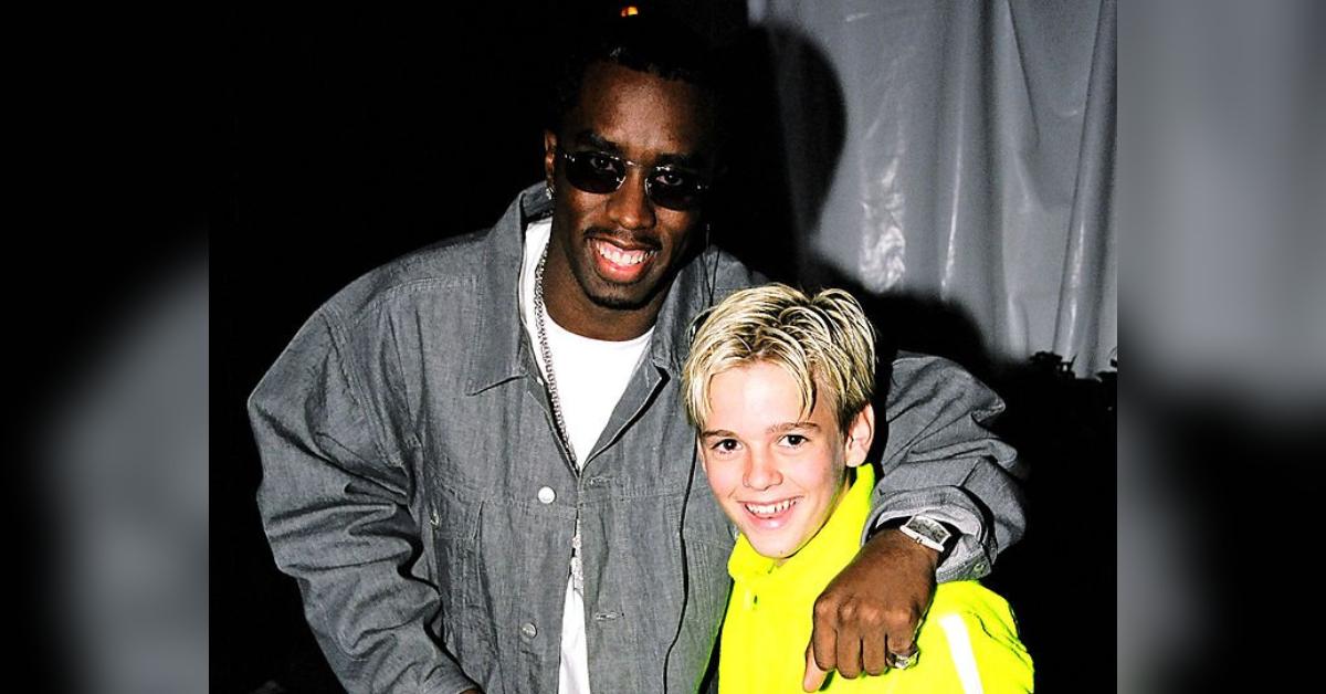 Diddy poses with a young Aaron Carter in 1999.