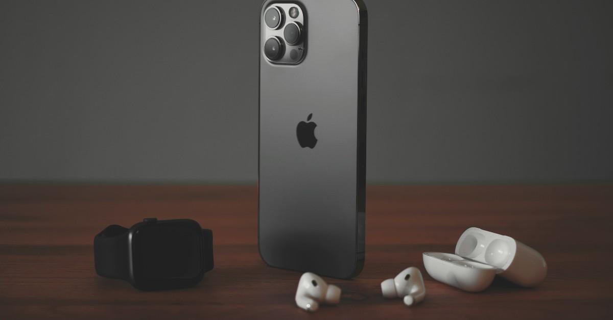 iPhone on a table with wireless headphones