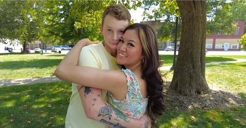 Sam and Citra hugging in a park