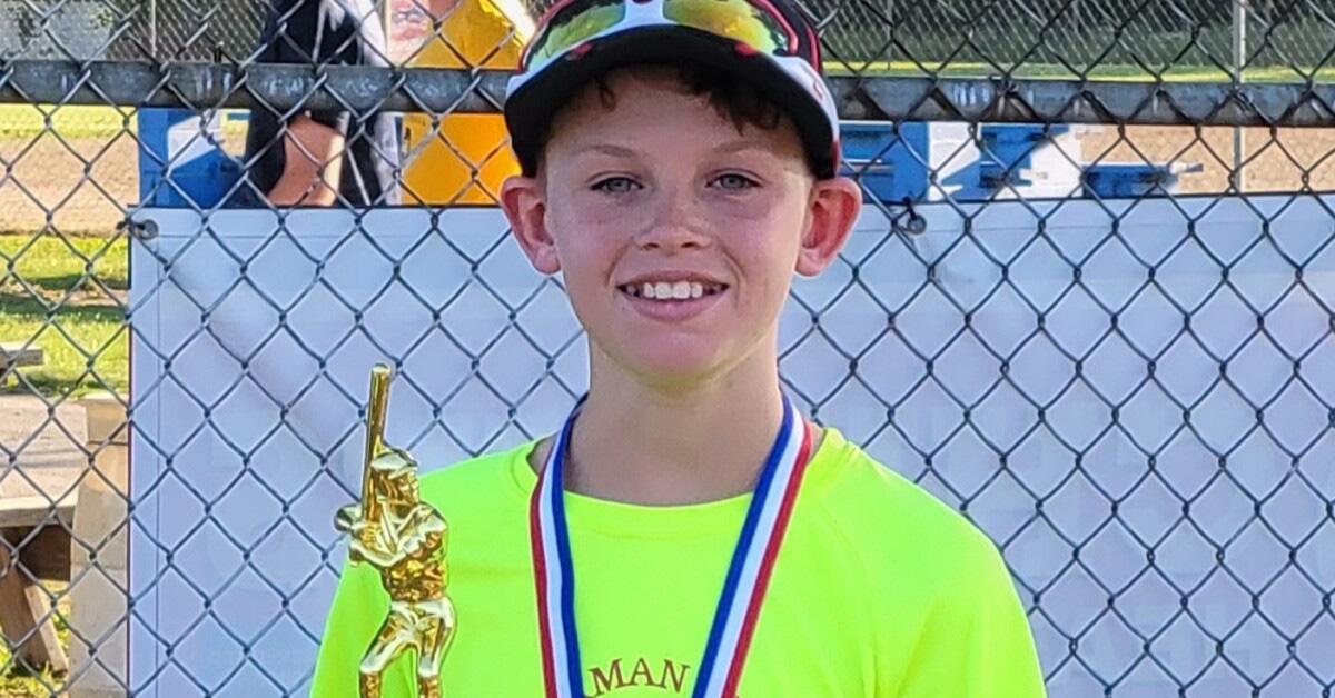 Aiden Clark holding a trophy. 