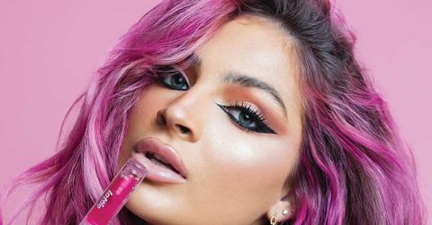 Carrington Durham with her Lottie London lip oil.