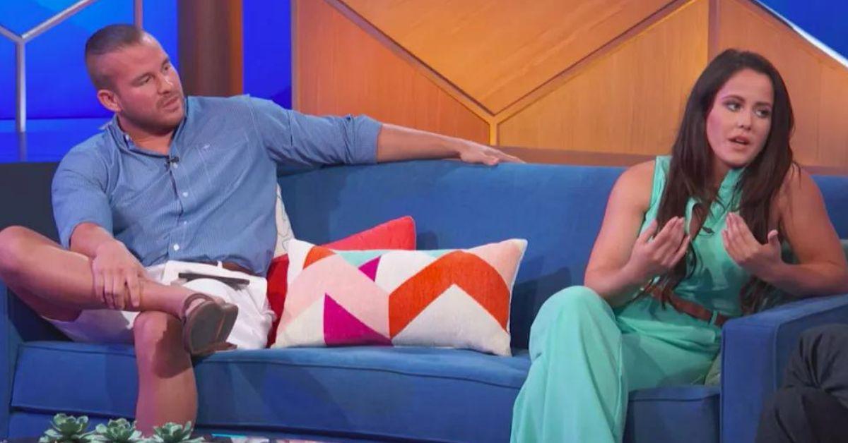 Nathan Griffith and Jenelle Evans sit next to each other on a blue couch