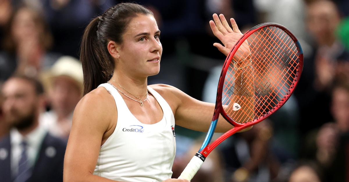 Emma Navarro waves to fans as she celebrates winning match point against Coco Gauff in the Ladies' Singles fourth round match during day seven of The Championships Wimbledon 2024 at All England Lawn Tennis and Croquet Club on July 7, 2024 in London, England