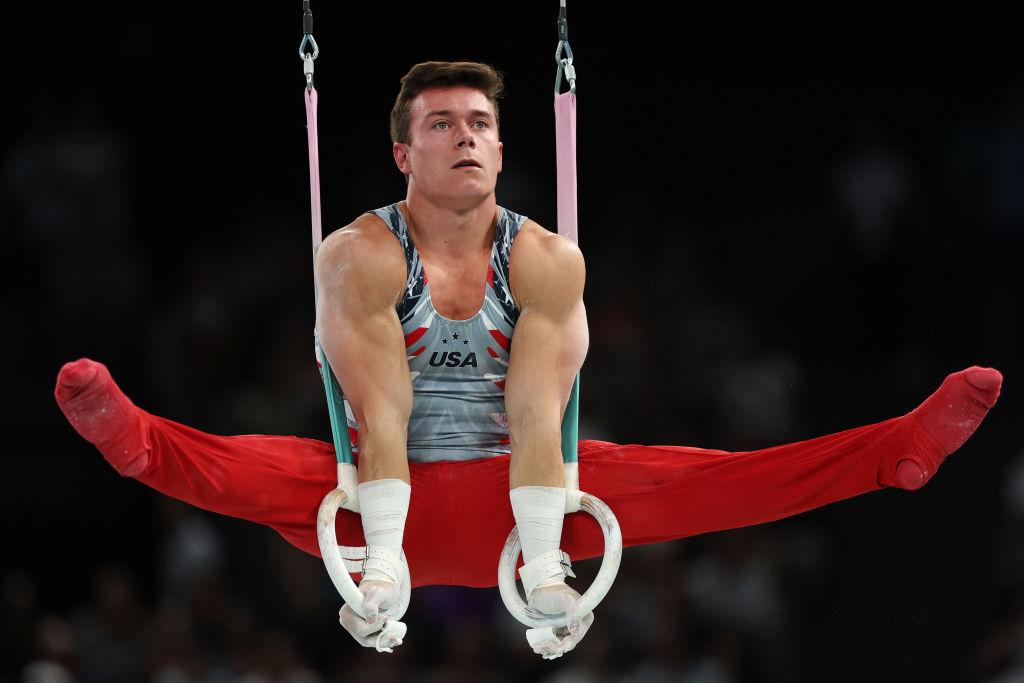 Brody Malone performing on the rings