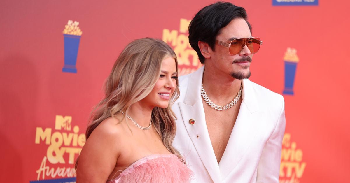 Ariana Madix and Tom Sandoval pose on the red carpet at the the 2022 MTV Movie & TV Awards: UNSCRIPTED on June 5, 2022.