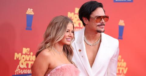 Ariana Madix and Tom Sandoval pose on the red carpet at the the 2022 MTV Movie & TV Awards: UNSCRIPTED on June 5, 2022.