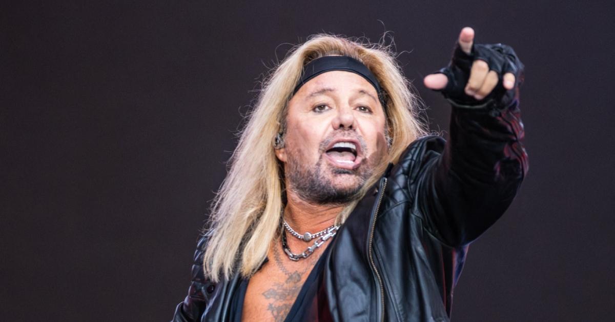 Vince Neil performing onstage in 2023