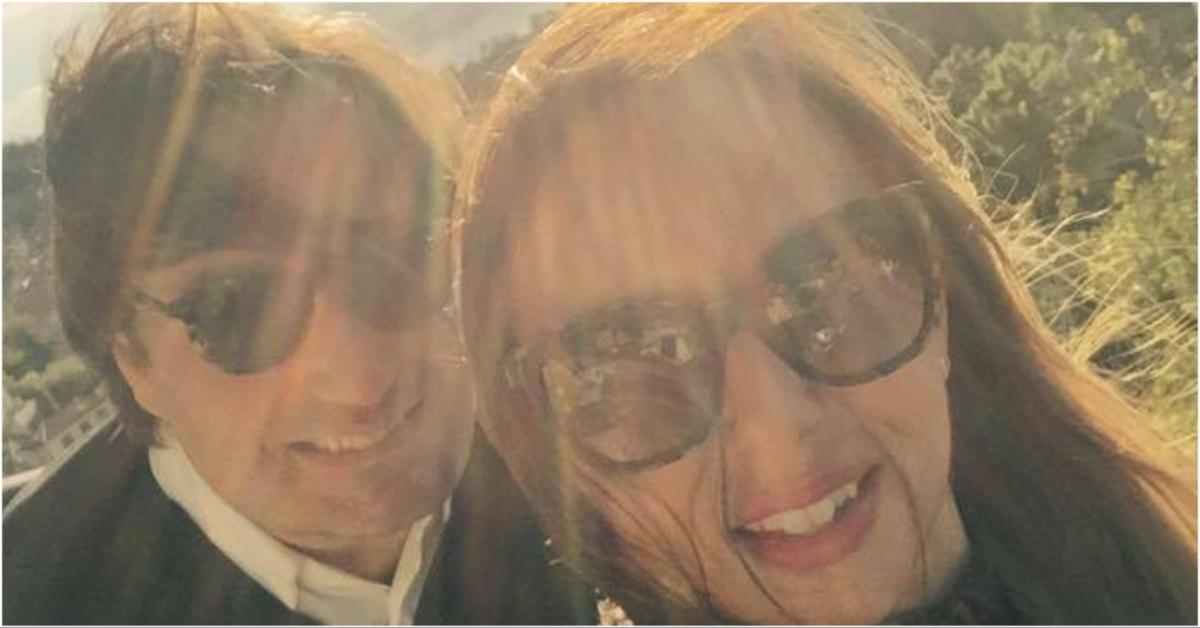 Ana Walshe and her husband taking a photo outside