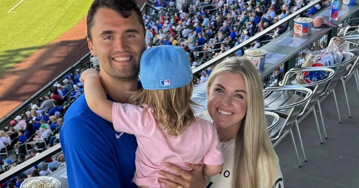 Charlie and Erika Kirk with their daughter at a baseball game.
