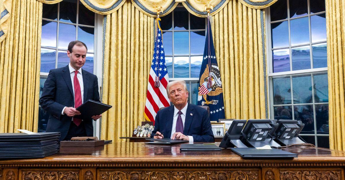 Donald Trump signing executive orders in the White House on Inauguration Day. 