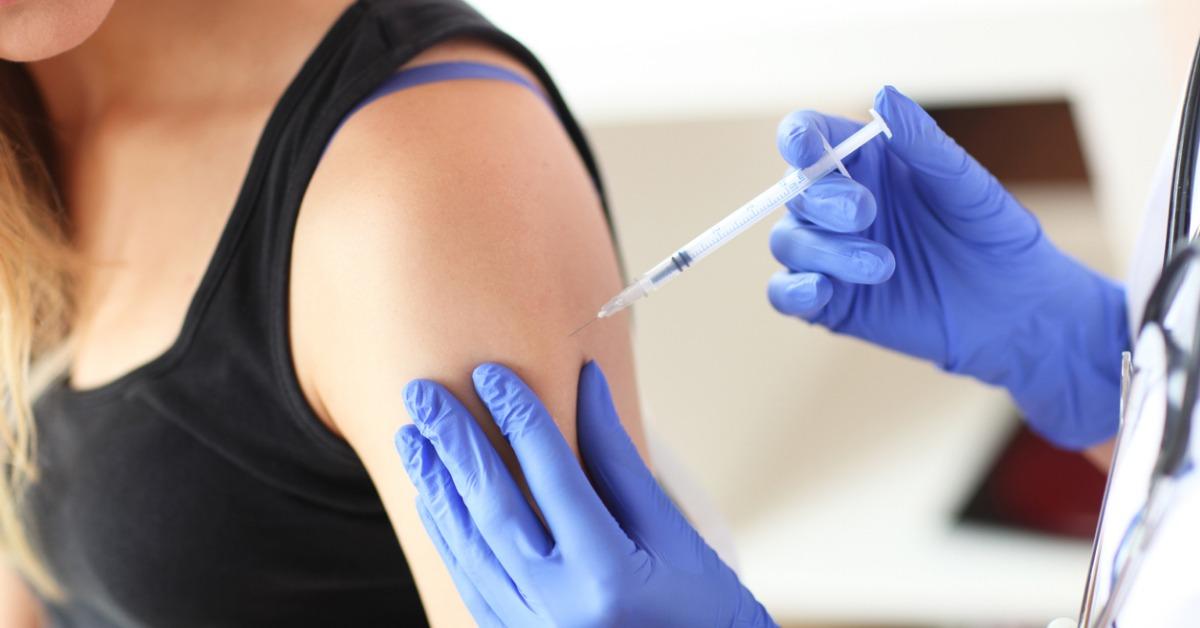 young doctor giving a patient injection picture id