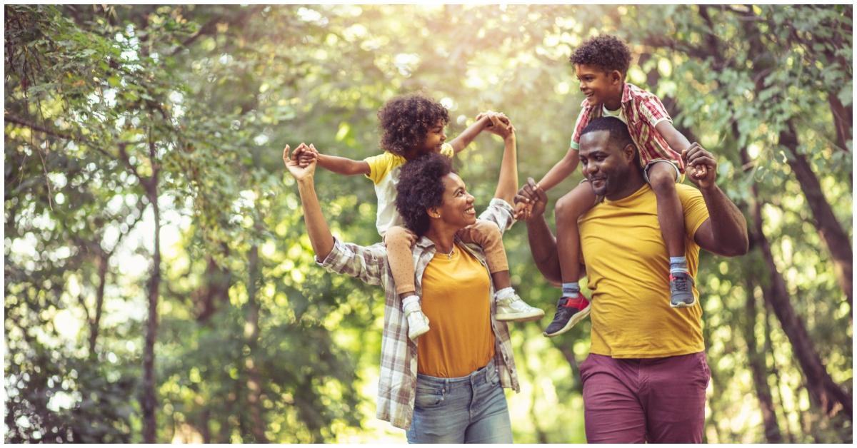 A Black family walking outside