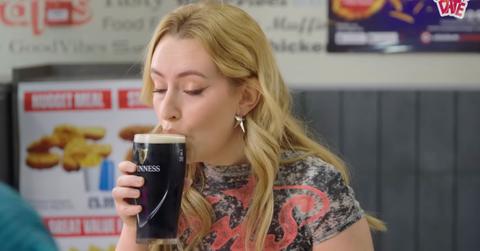 Amelia Dimoldenberg sipping Guinness.