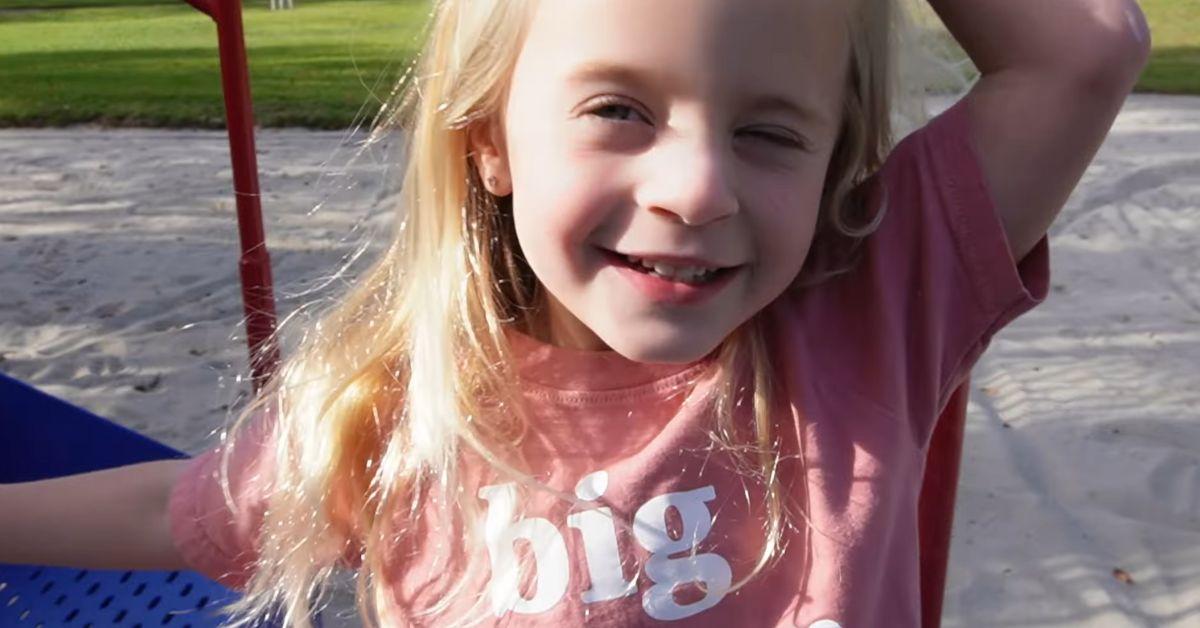 Posie LaBrant poses with a smile on a playground