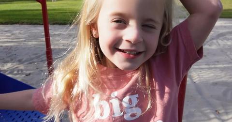 Posie LaBrant poses with a smile on a playground