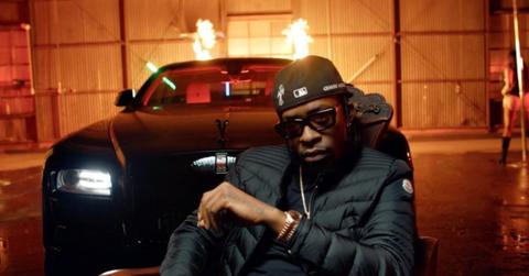 Rich Homie Quan in front of car