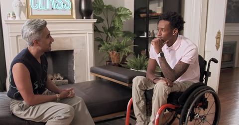 Still shot of Tan France and Speedy having a conversation.