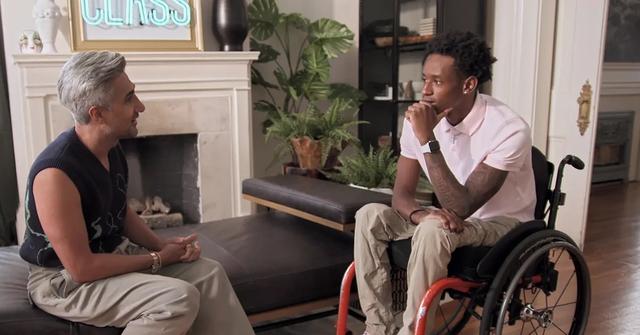 Still shot of Tan France and Speedy having a conversation.