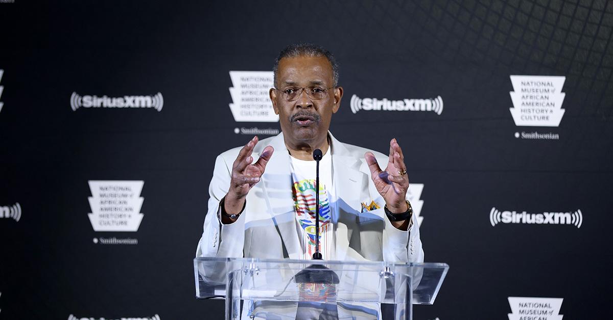 Joe Madison speaking at a podium for SiriusXM