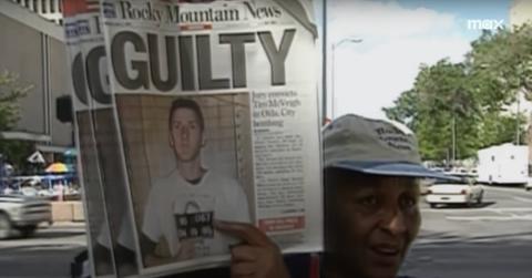 A woman holds up a newspaper declaring Timothy McVeigh is guilty