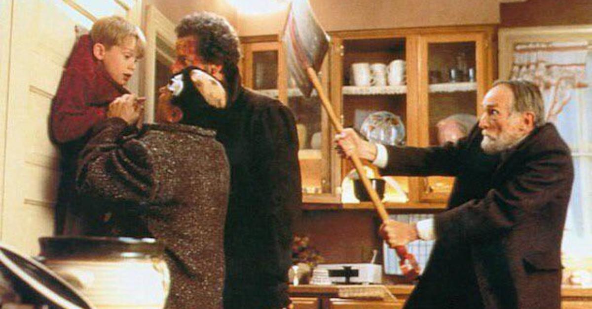 Kevin's neighbor hits Harry and Marv with a shovel in Home Alone