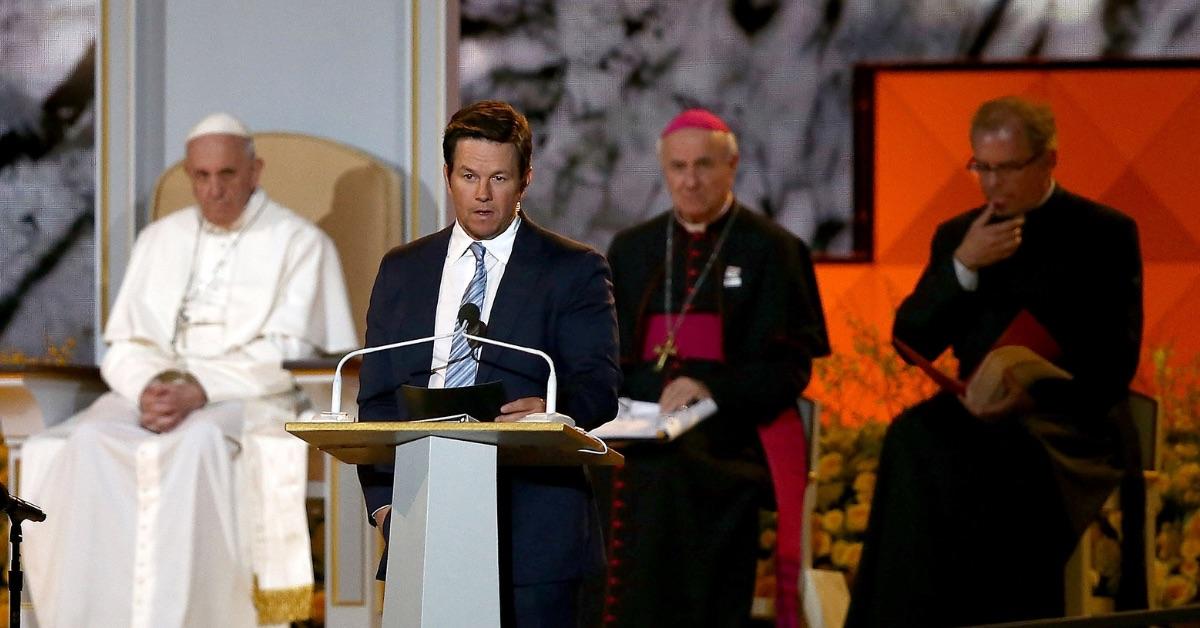 PHILADELPHIA, PA - SEPTEMBER 26: Actor Mark Wahlberg (C) speaks as Pope Francis (L) speaks during the Festival of Families on September 26, 2015 in Philadelphia, Pennsylvania. Pope Francis is wrapping up his trip to the United States with two days in Philadelphia where he will attend the Festival of Families and will meet with prisoners at the Curran-Fromhold Correctional Facility. (Photo by Carl Court/Getty Images)