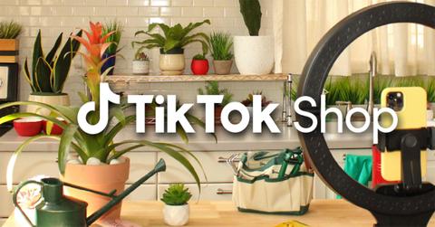TikTok Shop Logo in front of a table with plants.