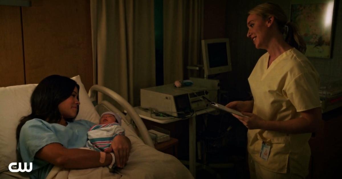jane the virgin in a hospital bed after giving birth to her first son