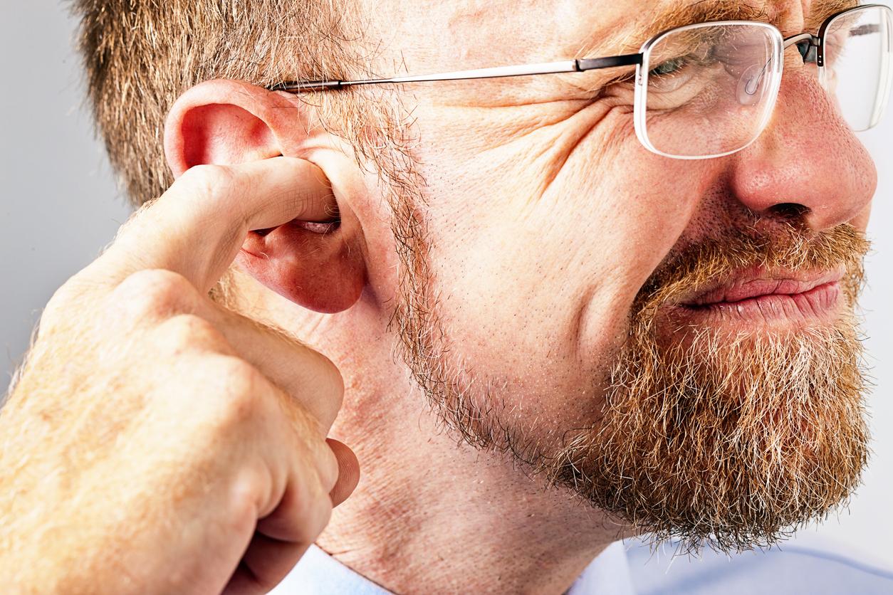 impacted ear wax symptoms