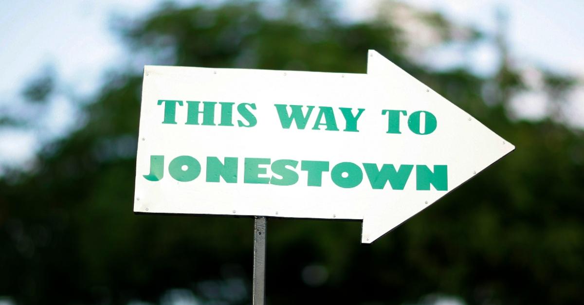 An arrow sign directs people to Jonestown