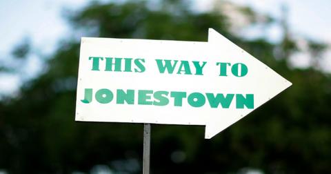 An arrow sign directs people to Jonestown