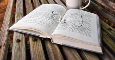 Open book with reading glasses