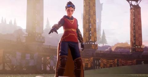 A Quidditch Champions player summoning their broomstick while on a Quidditch pitch.