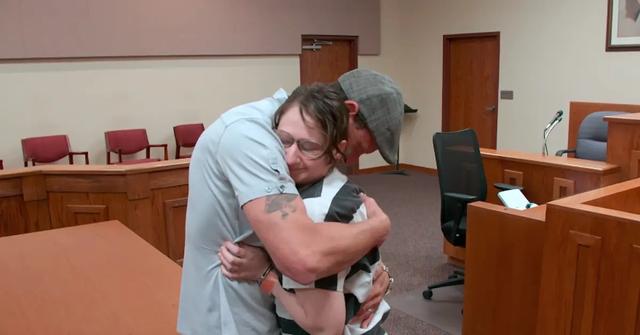 Gypsy Rose Blanchard hugging a man in court.