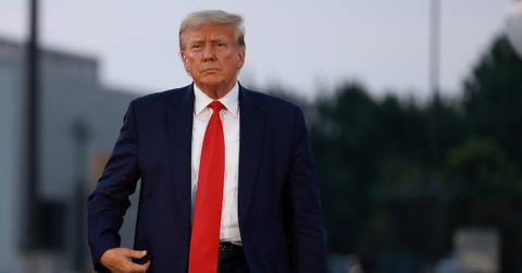 Donald Trump at the airport after being booked at the Fulton County jail on Aug. 24, 2023